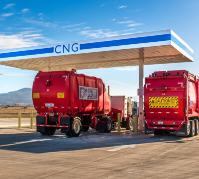 Two red trucks at Rogue Clean Fueling Station